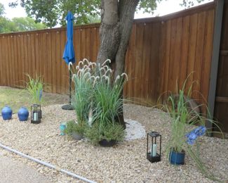 Planters, plants, lanterns, umbrella