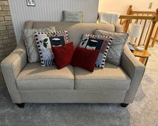 Another loveseat with throw pillows
