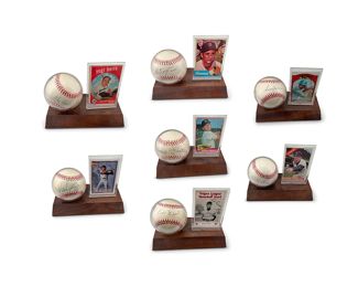 166
A Group Of Baseball Collectibles And Memorabilia
Comprising 51 autographed baseballs with associated trading cards mounted together on a wooden display, 1 autographed baseball from 1992 housed in an acrylic display case and autographed by various retired members of the All-American Girls Professional Baseball League, famously known as the adapted version of the book and movie "A League of Their Own," including signatures from Lavone A. "Pepper" Paire Davis (1924-2013, Racine Belles), Helen "Nickie" Fox (1920-1921, Rockford Peaches), Alice "Lefty" Hohlmayer (1925-2017, Kenosha Comets), Dorothy "Dottie" Kamenshek (1925-1010, Rockford Peaches), and Margaret "Marge" Wenzell (1925-2014, South Bend Blue Sox), 3 signed baseballs with affixed name plaques of the player's name, all on a wood display, including Sammie Haynes (Atlanta Black Crackers, Negro Baseball League), (Fran Matthews (1916-1999, Newark Eagles, Negro Baseball League), and Merle Porter (1921-2000, Kansas City Stars, Negro 