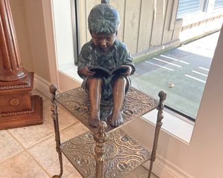 Bronze statue girl reading book