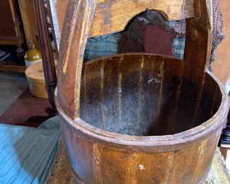 Early wooden well bucket. Iron strap and ring