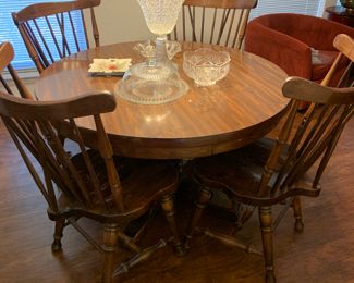 solid oak table with 2 leaves and 8 chairs, lovely AND sturdy!