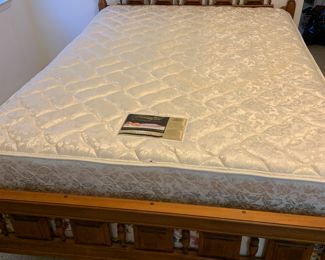 queen size beauty rest firm mattress, box springs, and solid wood bed