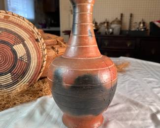 Pottery vase with etched bands, has hairline cracks on one side that has not been repaired but appears sturdy and intact despite this, from the Congo, mid-century 12"H