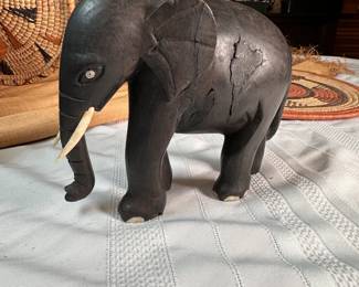 Hand carved ebony elephant with bone tusks and toes with some missing, body shows some age, from the Congo, mid-century 5.5"H