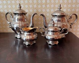 Silver plating over porcelain tea & coffee set with creamer & sugar, custom designed on Hutschenreuther porcelain, one pot inner lid has a hidden wedge chip (Lot R)