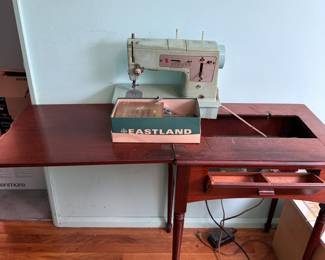 Vinage Singer sewing machine model 338, with sewing table, does get power to light, foot pedal does not make the machine work, table hinges do not lower machine into table, comes with attachments