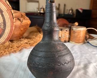 Pottery vase/jug with carved bands, chipped at top, repaired where neck joins the body 9.5"H