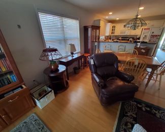 Hancock and Moore Leather Recliner, Vintage Pottery Lanp with a Woven Wicker Shade, Round Turnstyle Library Book Table, Mahogany Sofa Table 
