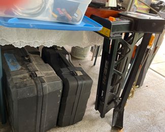 Portable band saw and extra blades and grinder in case