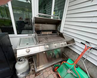 Members mark grill with rotisserie 