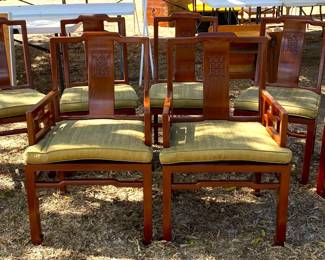 One of several sets of dining room chairs, Asian and American.