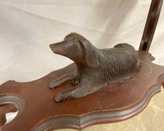 CLOSE UP OF CARVED DOG 
