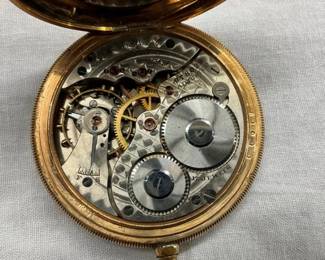 CLOSEUP INSIDE POCKET WATCH