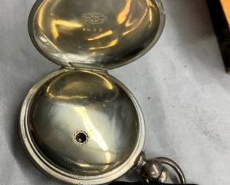 CLOSEUP INSIDE POCKET WATCH