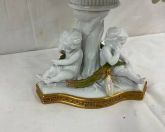 CLOSEUP VIEW ORNATE FIGURAL BASE