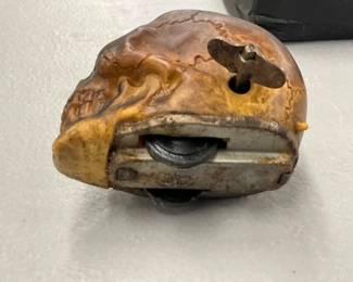 UNUSUAL WINDUP SKULL TOY