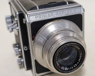 1022	PRIMA REFLEX II CAMERA, MIRROR BAD AND SHUTTER JAMMED
