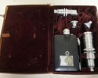1054	KODAK 16 MM MOVIE CAMERA WITH 4 LENSES
