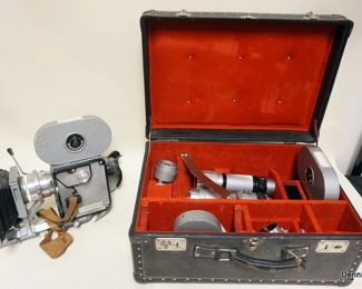 1062	 PENTAFLEX 16 MM MOVIE CAMERA WITH LENS
