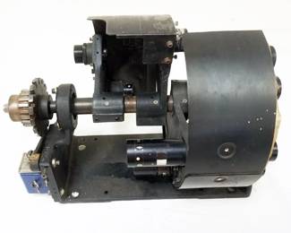 1142	MULTI LENS 16 MM PROJECTOR LENS CHANGER, APPROXIMATELY 16 IN X 11 IN X 11 IN

