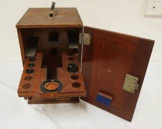 1158	ANTIQUE MAHOGANY MICROSCOPE CASE W/SOME LENSES, LOSS TO LEFT FRONT EDGE OF CASE, APPROXIMATELY 10 IN X 12 IN X 15 IN
