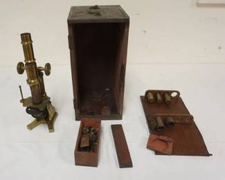 1212	ANTIQUE BRASS MICROSCOPE IN FITTED BOX, VERNEER ADJUSTMENT TO RAISE & LOWER STRIPPED, APPROXIMATELY 7 IN X 7 IN X 14 IN
