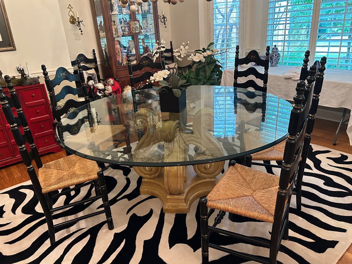 Round glass top dining table. 8 Nichols & Stone black ladderback chairs, 2 captain's and 6 side chairs.
