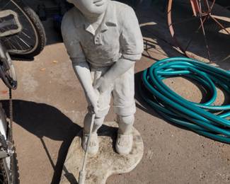 Concrete golf statue