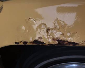 Rust is concentrated in trunk area, wheel wells and front head lights