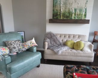 Aqua leather chair and velour tufted love seat.