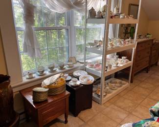 Large collection of sugar, creamers, salt and peppers and cups and saucers. 