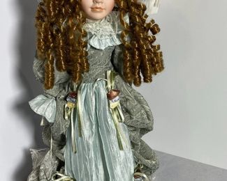 Curly Brown haired Porcelain Doll