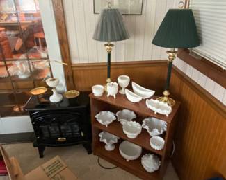 Milk Glass pieces on wooden shelves; 2 forest green lamps 