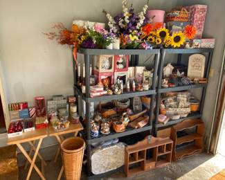 Longaberger Baskets; Yankee Candle items; artificial flowers; wooden shelves; snow globes; knickknacks 