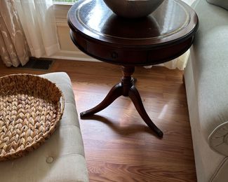 Mahogany round table with leather inlay top