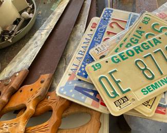 Hand saws, vintage car tags
