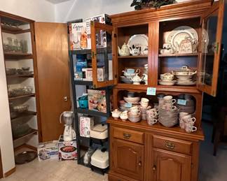 Clear Glassware;  Hamilton Beach Toaster; Rival Crockpot; Blender; Luminarc Glass Set; 20 Jar Rotating Spice Rack; B&D Can Opener; Food Scale; Corelle Glasses; Pioneer Women Bowl Set; Sunbeam Hand Mizer; Electric Skillets; Collectors Teapots; China; China Cabinet