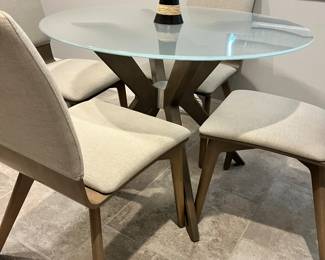 Modern, frosted glass table with 4 chairs