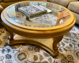 42 inch round coffee table, beveled glass, decorative iron, $450.00, Dianne Flack Interiors 