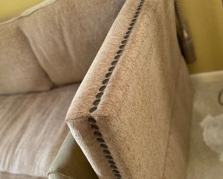 Comfortable and stylish with nailhead trim, and . decorated with pineapple finials and tassels $995.