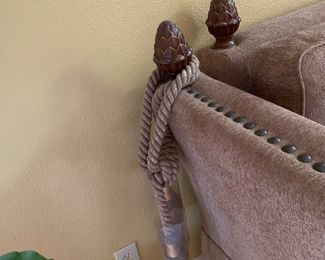 Comfortable and stylish with nailhead trim, and . decorated with pineapple finials and tassels $995.