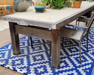 Solid concrete and steel patio table