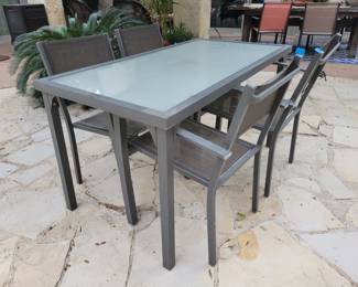 Glass and metal patio table and chairs