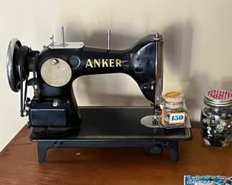 Antique Anker sewing machine with cabinet & drawers