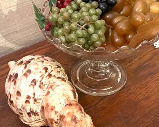 Incredible she’ll find! Artificial grapes in open dish, pretty!