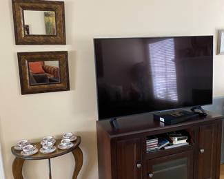 Big TV and nice TV stand.