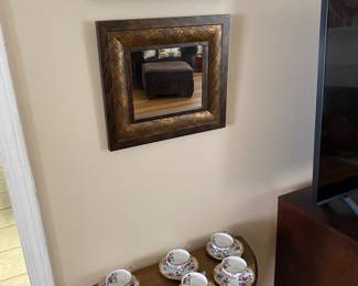 Cute tea set and table haunted by visions of porcelain eating Ottomans lurking nearby.