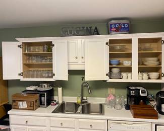 Kitchen cabinets full useful items.