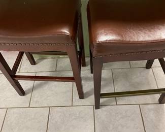 These leather tops with brass studs make great stool samples.